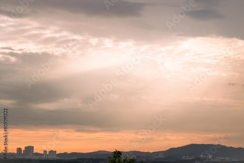 Sunrise over suburban city. Skyline view of cityscape with sunlight and flare in warm light color tone.