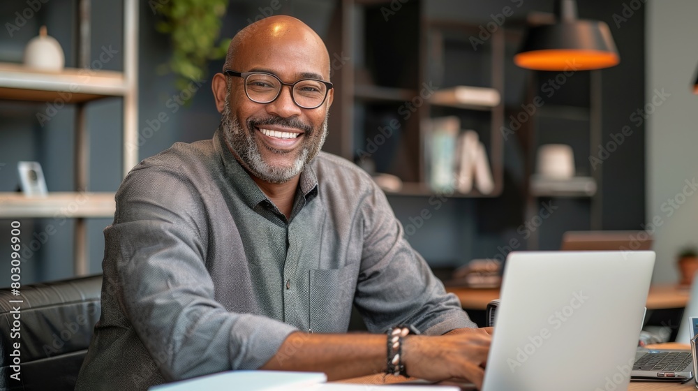 Smiling Professional at His Laptop Smiling Professional at His Laptop