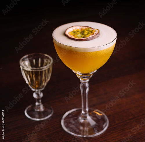 Elegant passion fruit cocktail with shot glass