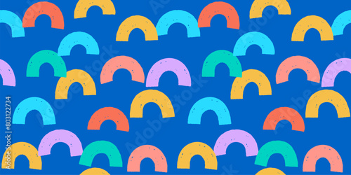 Seamless vector pattern with multicolored arch shapes on a vivid blue background, fun abstract festive texture design.