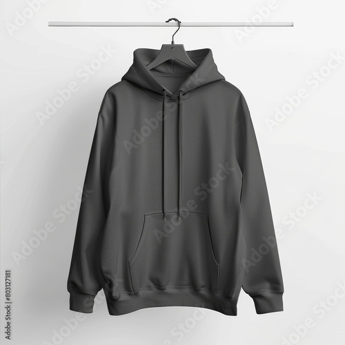 Hoodie mock-up hanging from a hanger in a well-lit minimalist setting perfect for clothing designers and retailers