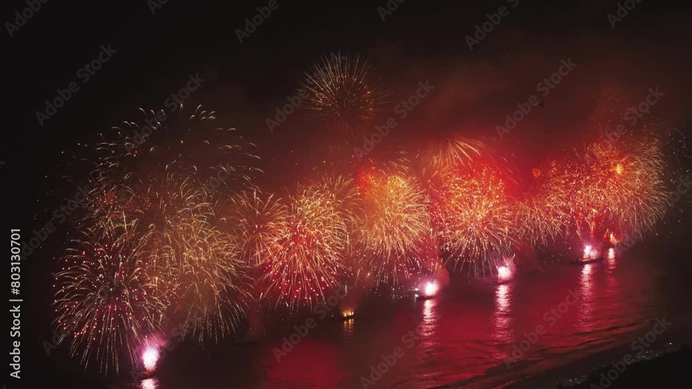 Reveillon New Years fireworks in Copacabana, Zoom view from Sugar Loaf, Rio de Janeiro, Brazil.