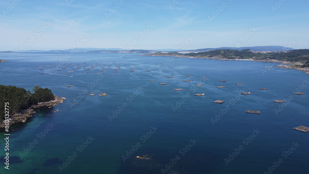 Galician Ria: Aerial Shot of Mussel Farms and Coastal Serenity
Galician Ria: Aerial Shot of Mussel Farms and Coastal Serenity