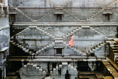 Woman at ancient stepwell in Jaipur
