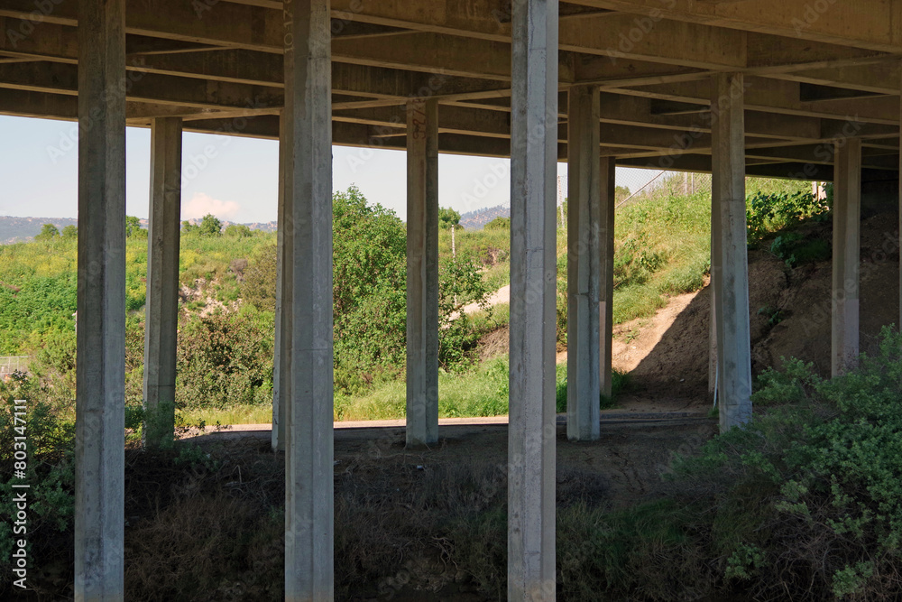 Concrete pillars under a freeway bridge Concrete pillars under a freeway bridge