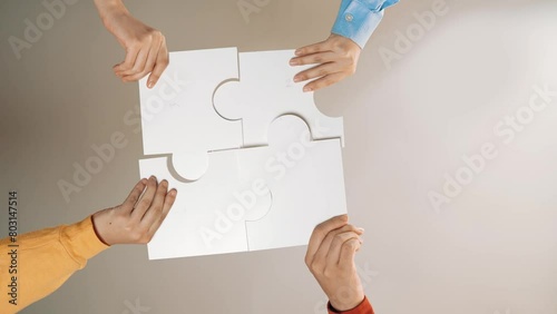 Startup company employee team gladly stacking hand together symbolize successful group of business partnership and strong collective unity teamwork in community workplace in panoramic video. Synergic