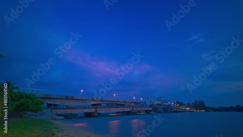 Time lapse pink cloud above Sarasin bridge at twilight.scenery sunset at Sarasin bridge. the bridge is the most important in making businesses 
from the provinces to Phuket has traded a lot of money photo