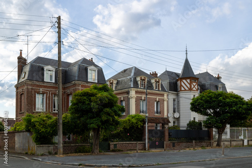 Beautiful street with traditional French buildings with wooden beams and colorful, surroundings of La Cathédrale Saint-Pierre, Beauvais, France.