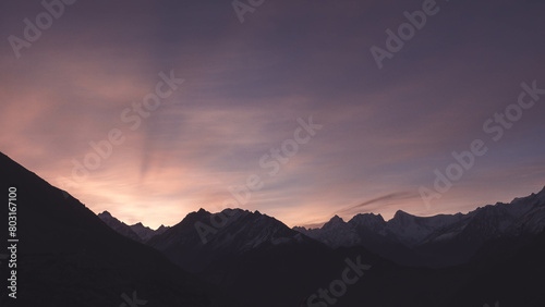 First light one morning on a cold snowy mountain