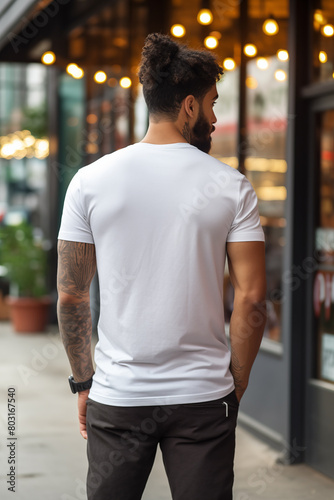Back view of a man wearing a plain white T-shirt