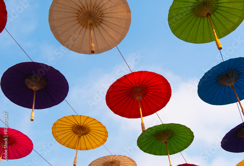 Umbrellas made from colorful Asian trees are hung at festivals