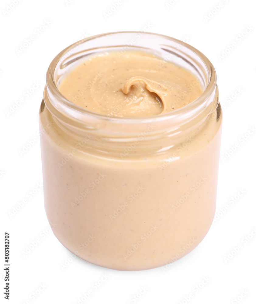 Tasty nut paste in jar isolated on white