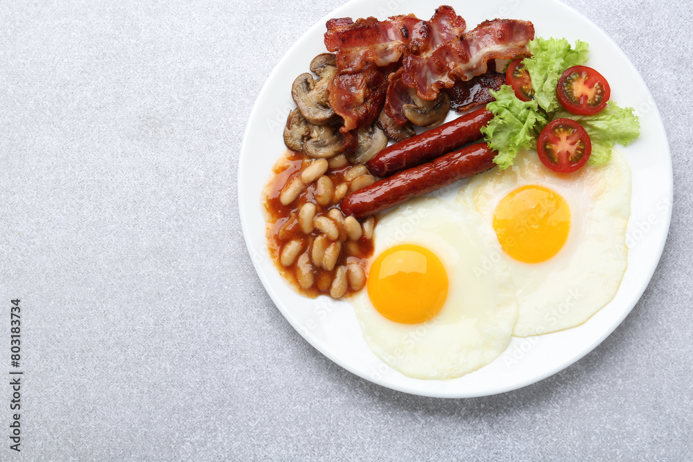 Delicious breakfast with sunny side up eggs on light table, top view. Space for text Delicious breakfast with sunny side up eggs on light table, top view. Space for text