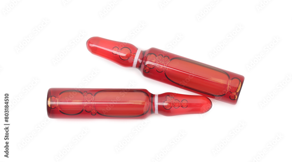 Glass ampoules with liquid isolated on white, top view Glass ampoules with liquid isolated on white, top view