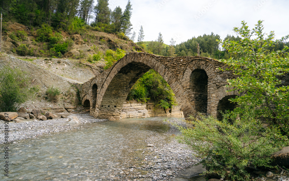 Fototapeta premium The Old Mes bridge near Shkoder. Albania, Europe. Ottoman stone arch bridge Ura e Kadiut