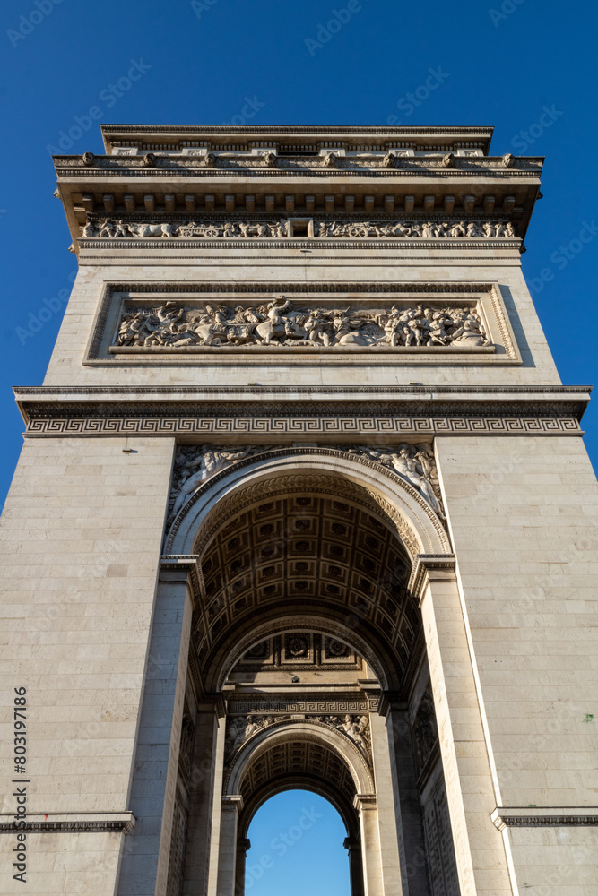 Obraz premium Arc de Triomphe de l'Étoile, located on the Charles de Gaulle square, and at the western end of the Champs Elysées avenue. Paris, France