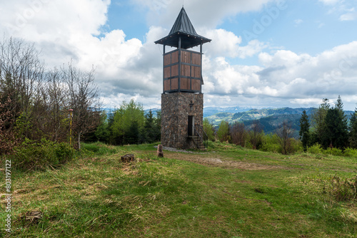 Hladky vrch hill with lookout tower above Zborov nad Bystricou village in Slovakia photo