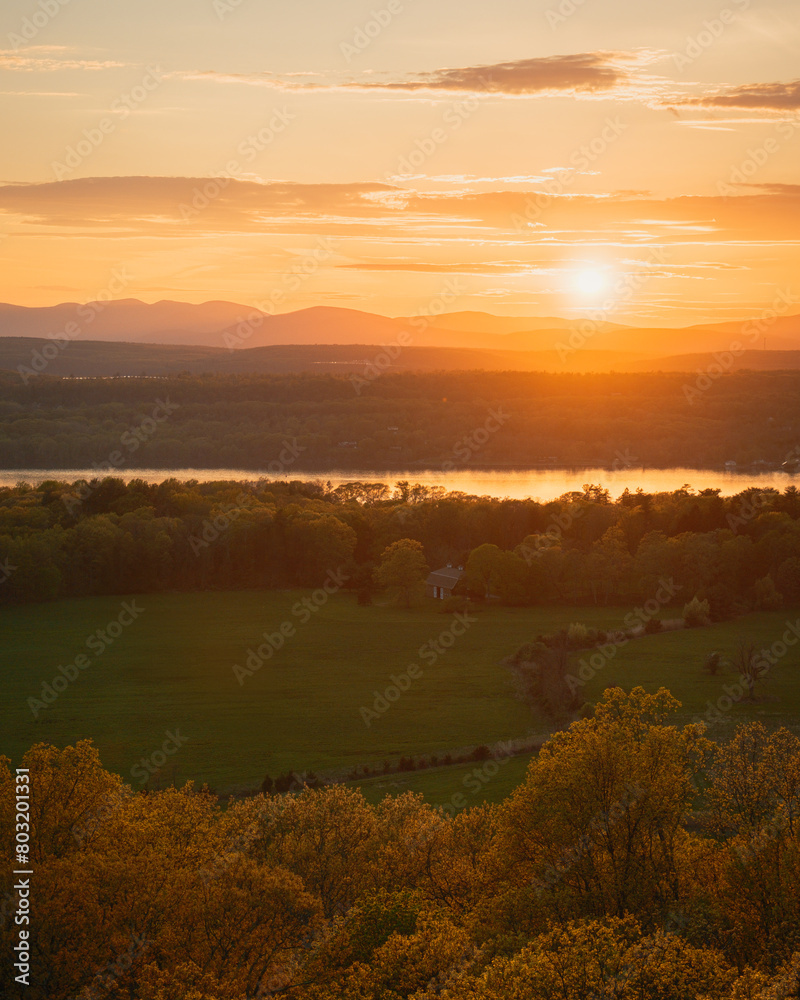 Sunset view over the Hudson River from the fire tower on Mount Rutsen, in Ferncliff Forest, Rhinebeck, New York