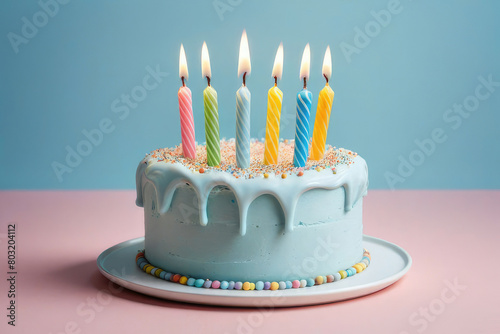 birthday cake with 6 six candles on pastel blue background