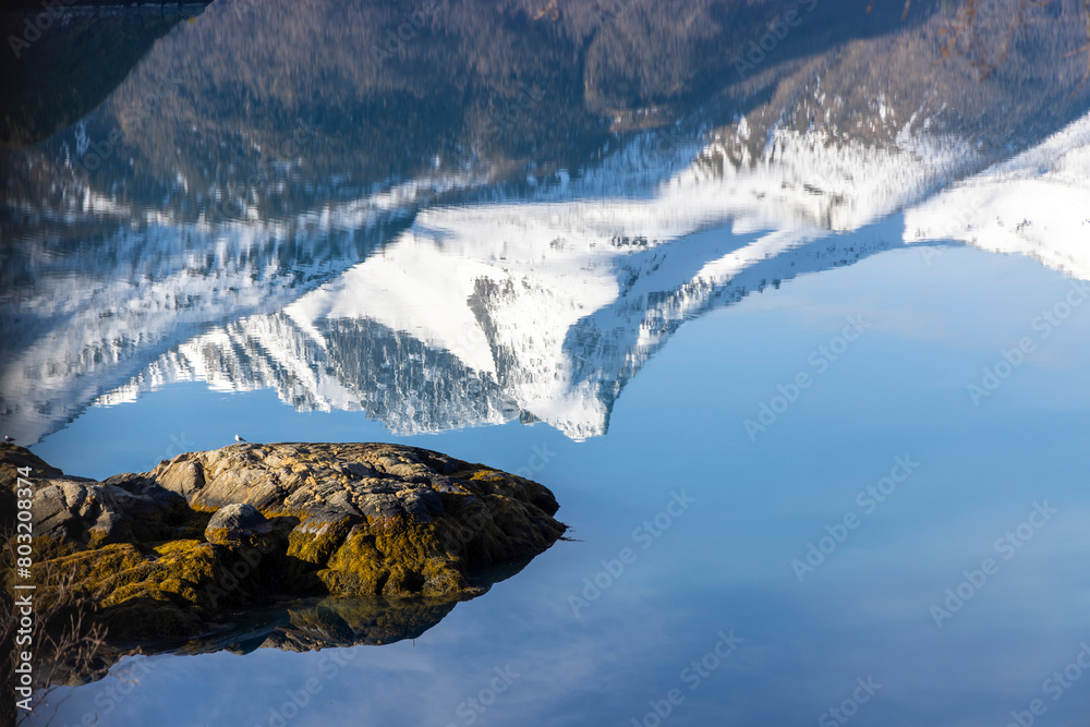 Reflection of the Svartisen glacier in the Holandsfjord in Nordland county, Norway