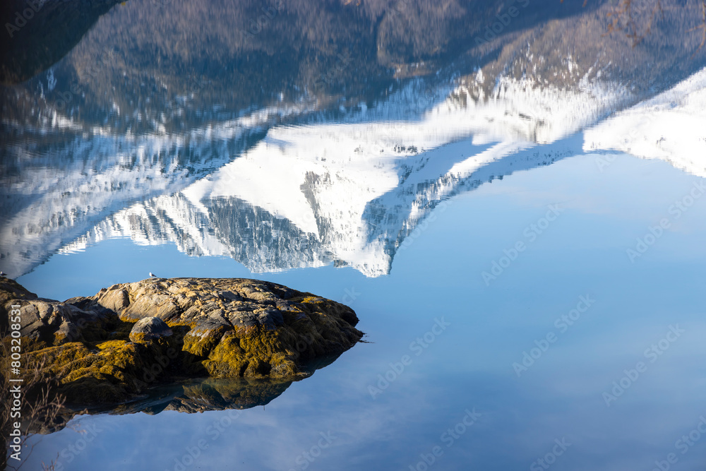 Reflection of the Svartisen glacier in the Holandsfjord in Nordland county, Norway
