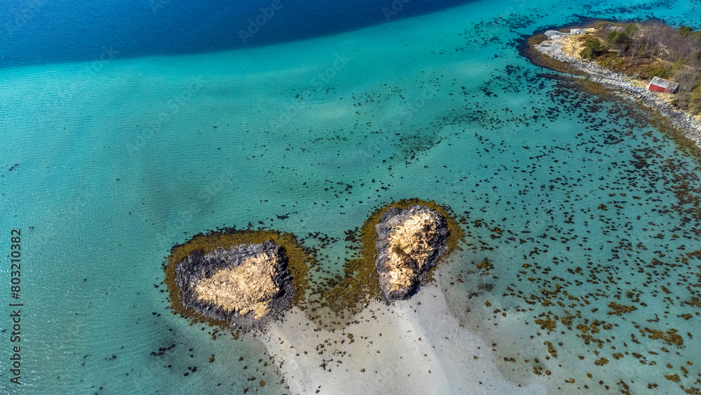 Drone shot over the islands of Storoya, Hestoya, Amnoya and Gronnoya in Nordland county, Norwa