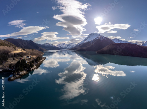 Obraz na płótnie Panoramic drone view of Holandsfjord and Nordfjord in Nordland county. In the background is the Svartisen glacier, Norway's second largest glacier w salonie