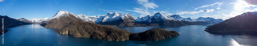 Panoramic drone view of Holandsfjord and Nordfjord in Nordland county. In the background is the Svartisen glacier, Norway's second largest glacier