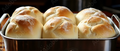 A close up of a baking tray of bread rolls