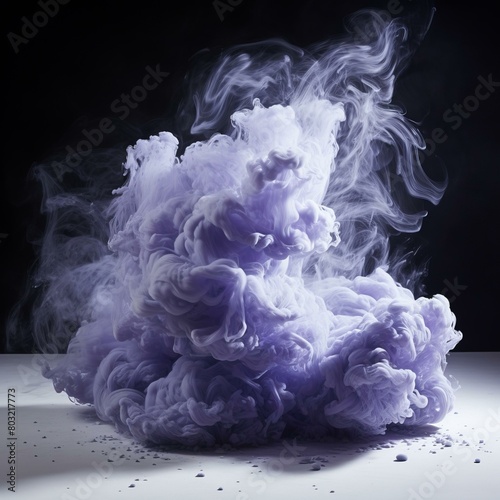 Purple smoke cloud on white surface with black background photo
