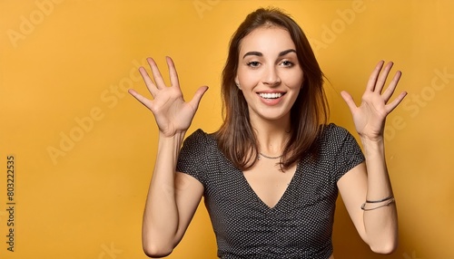 girl receiving a pleasant surprise, excited and raising hands