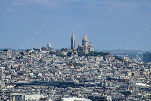 Sacré-Cœur is a basilica on top of Montmartre hill (Paris, France). Panoramic view of the roofs of the buildings around the Tour Eiffel, Paris, France