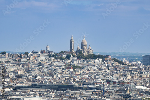 Sacré-Cœur is a basilica on top of Montmartre hill (Paris, France). Panoramic view of the roofs of the buildings around the Tour Eiffel, Paris, France