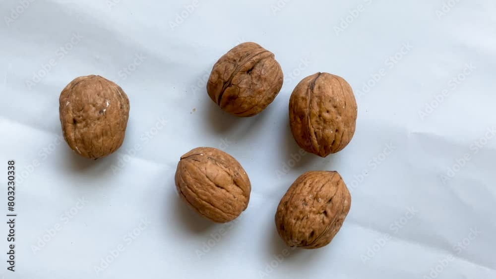 Dried walnuts on gray background. Healthy eating lifestyle. Top view. Dried walnuts on gray background. Healthy eating lifestyle. Top view.