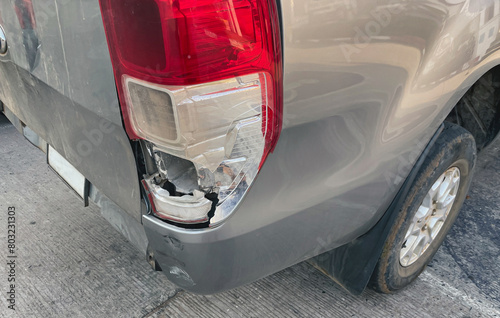 A car's tail light breaks as a result of a collision or a car accident. car insurance