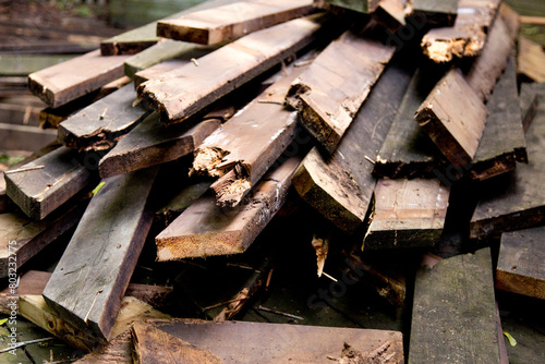 a pile of old wood boards from a demolition site