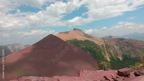 Red Rock mountains hiking in the summer perfect weather day. fluffy clouds traveling about high in soft blu. Alberta's waterton  Naturalpark. 4k time-lapse footage nature background. landscape video. photo
