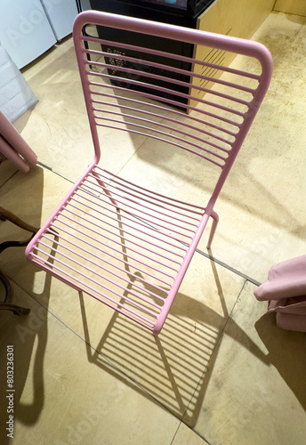 Close-up of a pink metal chair