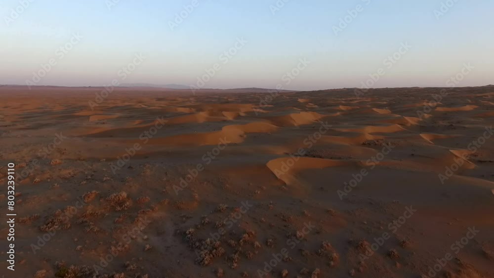 Sunset in the desert and sand dunes of the golden and red desert High resolution and quality aerial footage. Sunset in the desert and sand dunes of the golden and red desert High resolution and quality aerial footage.