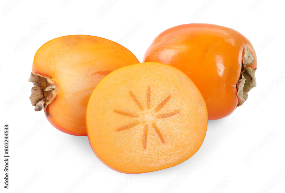 Whole and cut persimmon fruits isolated on white