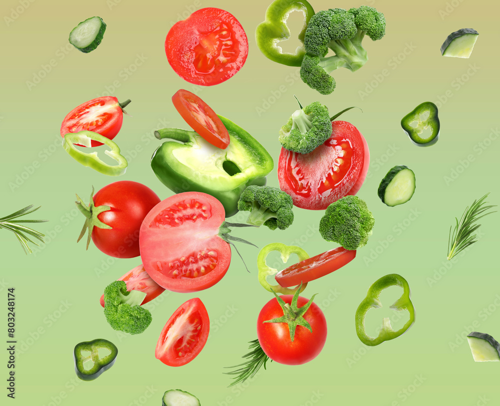Different fresh vegetables in air on green gradient background Different fresh vegetables in air on green gradient background