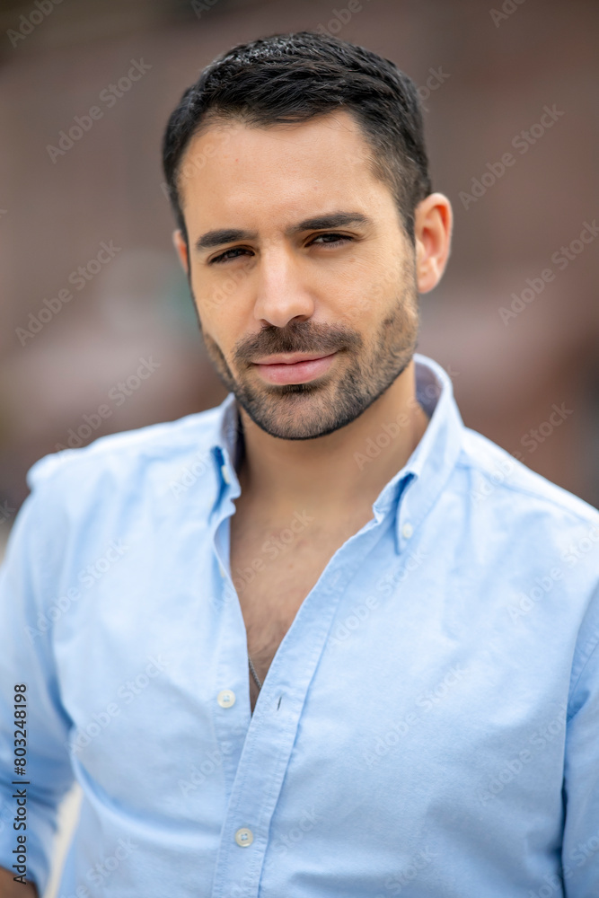 Cosmopolitan handsome man posing at camera in the city Cosmopolitan handsome man posing at camera in the city