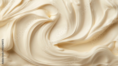 Image description: A close-up image of a smooth, creamy, white substance with a thick consistency.