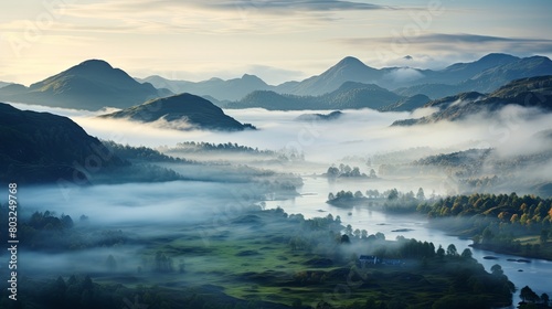 Misty mountain valley at sunrise with lush greenery