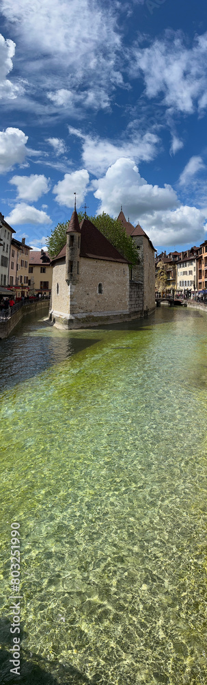 Annecy, Haute-Savoie, France, 04-21-2024: Palais de l'Ile, residence of the castellan of Annecy since12th century, built in the middle of the Thiou River, classified as Historic Monument of France