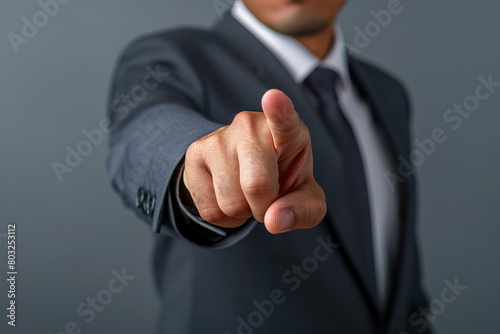 Businessman finger point to empty space, front view