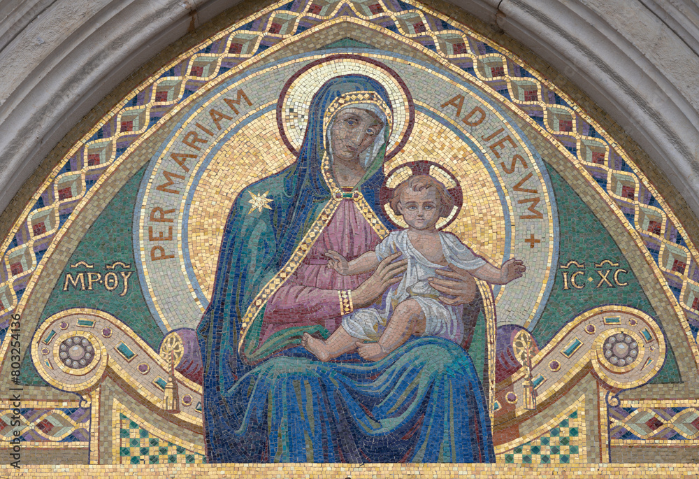 MILAN, ITALY - MARCH 7, 2024: The mosaic of Madonna on the facade of church Chiesa di Santa Maria del Suffragio by Spirito Maria Chiappetta (1927).