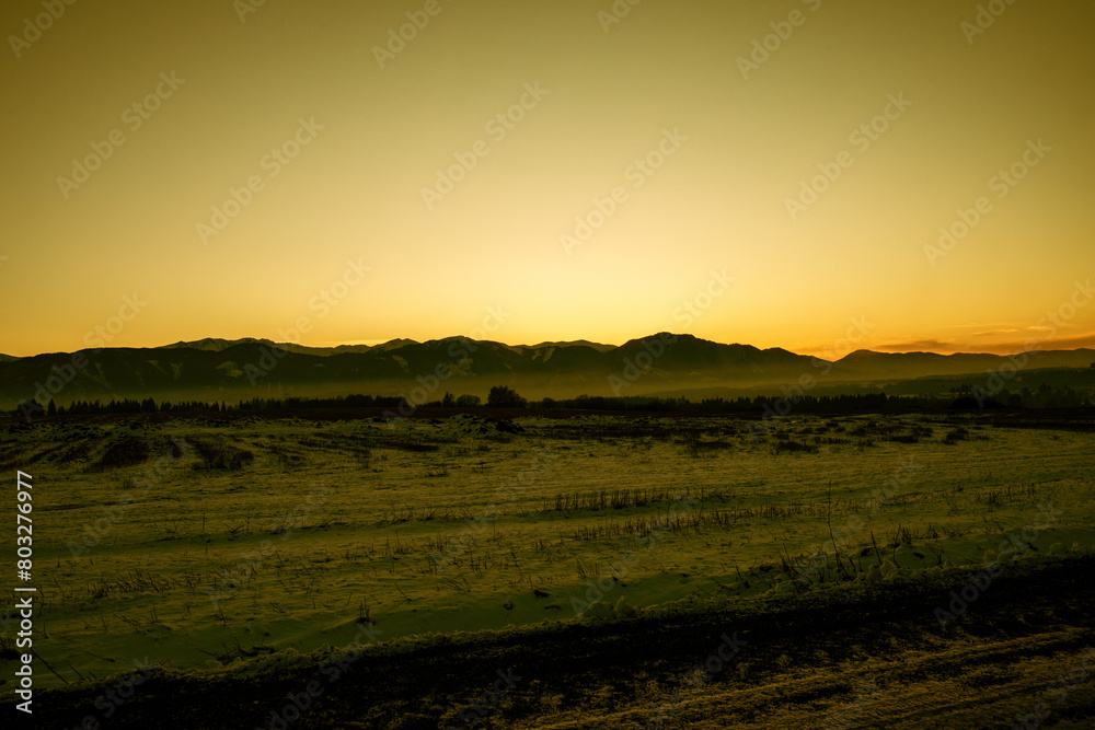 Sunset over mountains in winter season. Sunset over mountains in winter season.