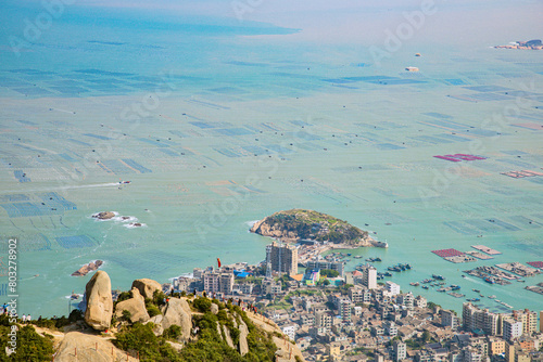 High angle view of the bay and fishing village on the top of the flag crown of Lianjiang County, Fujian Province photo