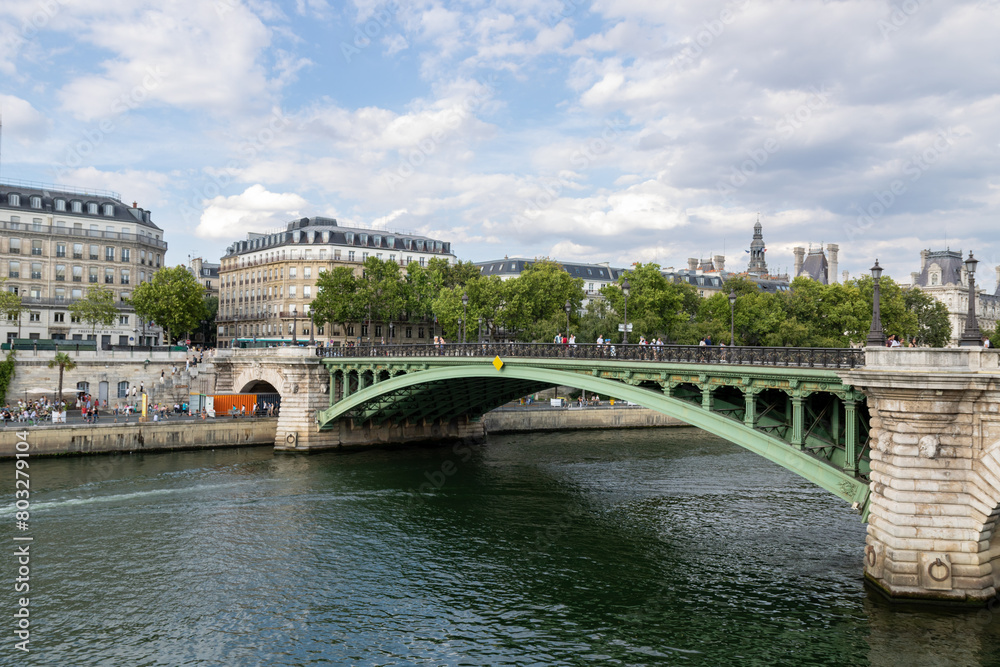 Naklejka premium Traditional French architecture buildings and bridge along the Seine River promenade, boat ride. Paris, France.